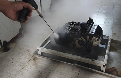 Steam cleaning of machine parts